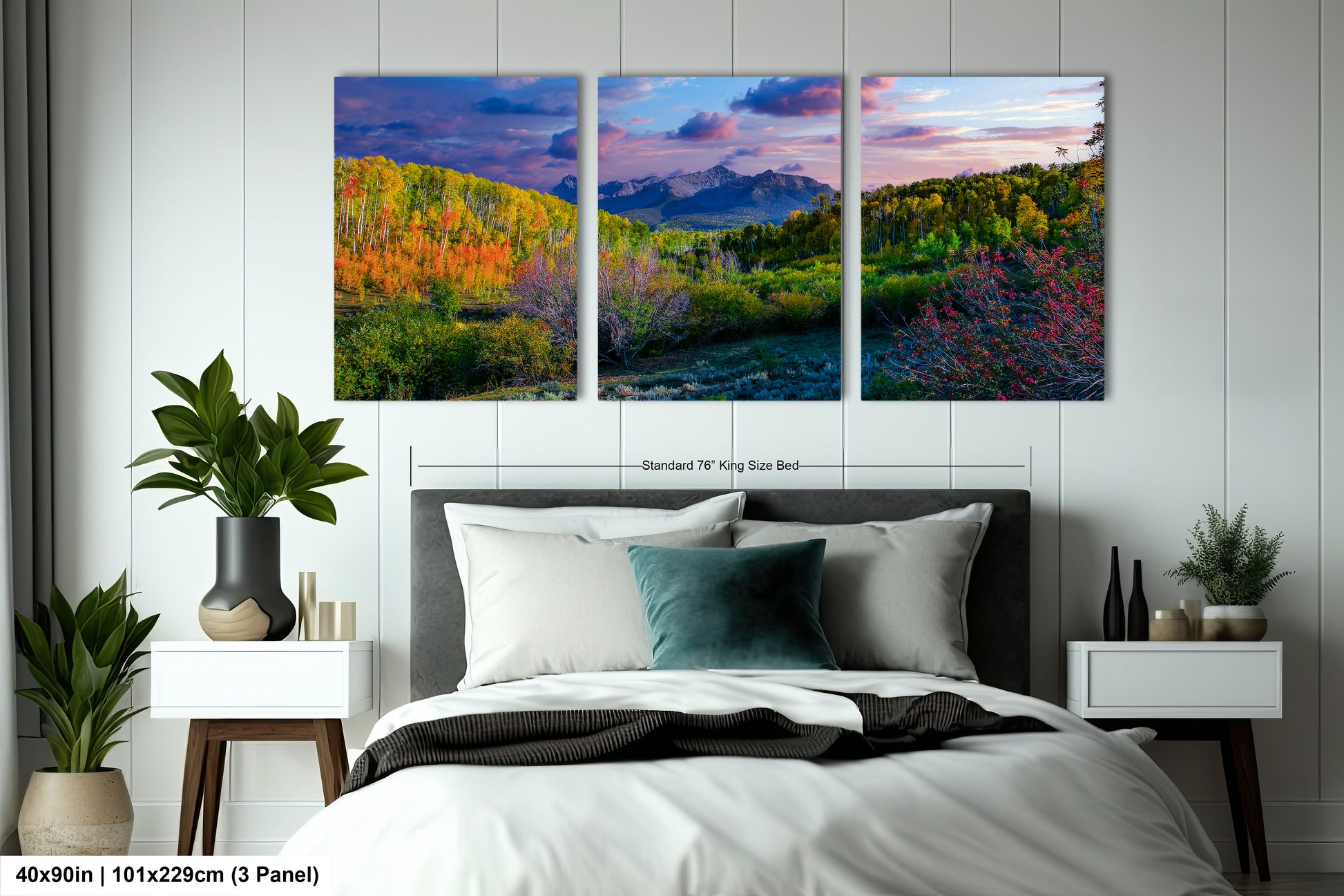 a bedroom with a bed and two paintings on the wall