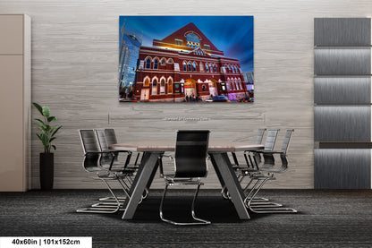 a table and chairs in a room with a painting on the wall