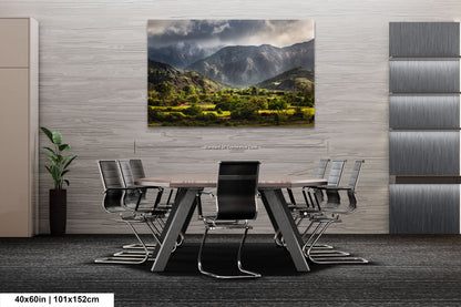a dining room table with chairs and a painting on the wall