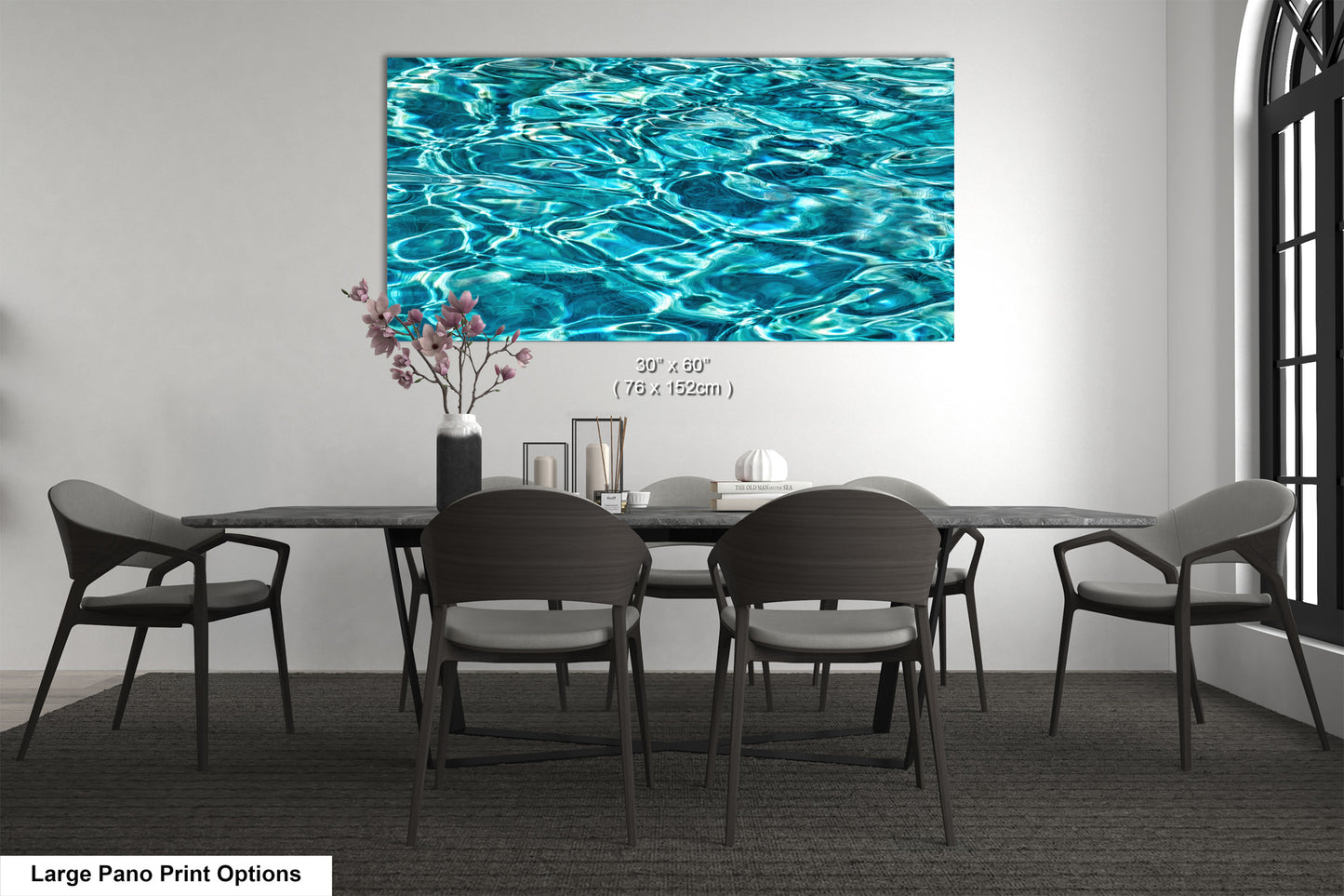 A modern dining room with a large abstract painting of water on the wall above a black table surrounded by six chairs.