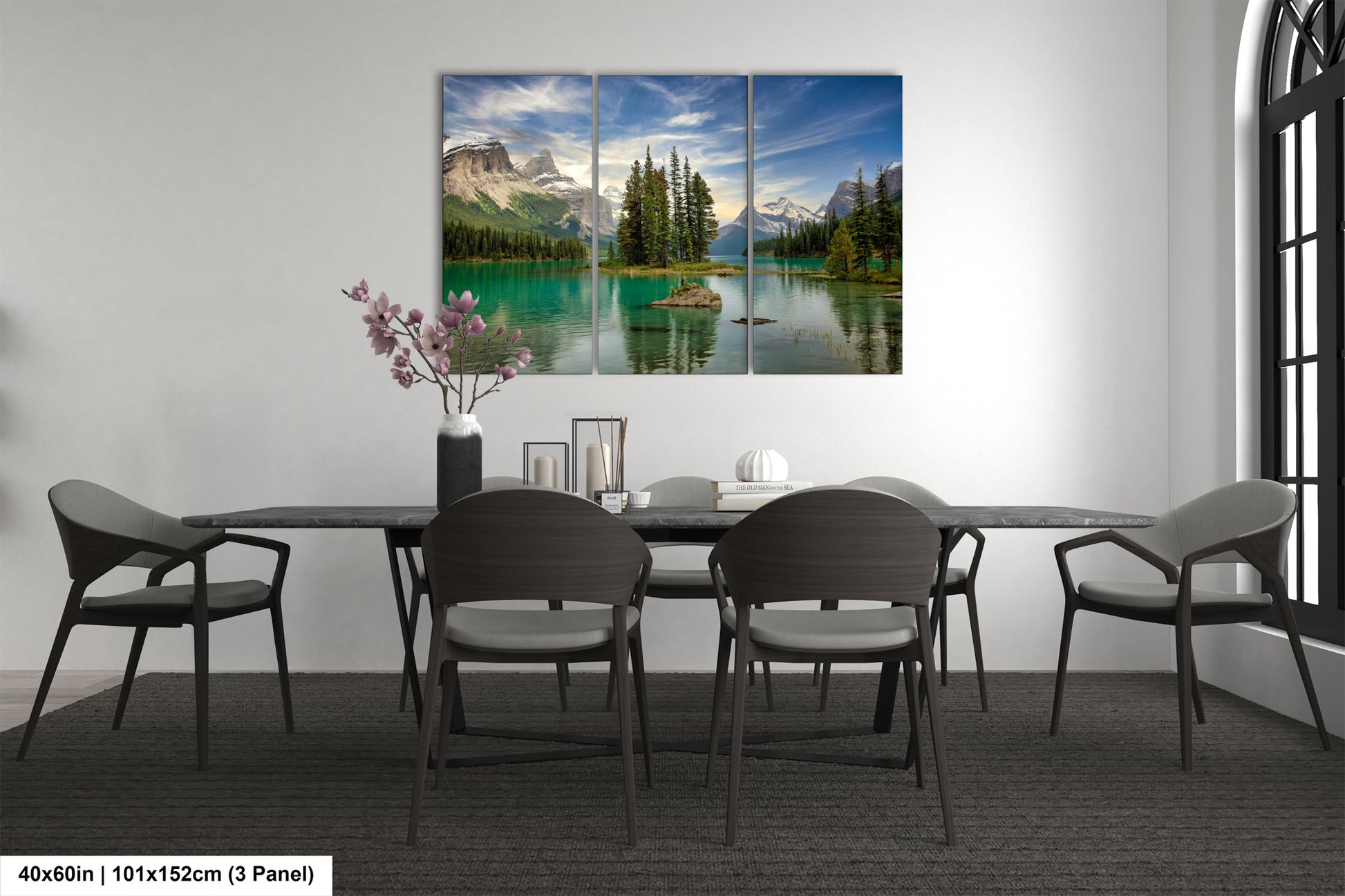 a dining room table with chairs and a painting on the wall
