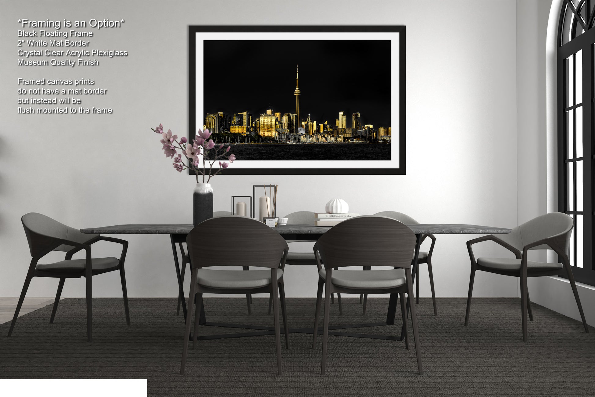 a black and white photo of a dining room table and chairs