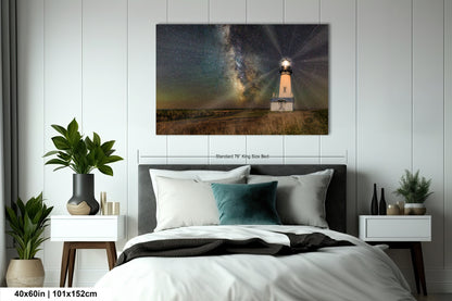 a bedroom with a bed and a painting on the wall