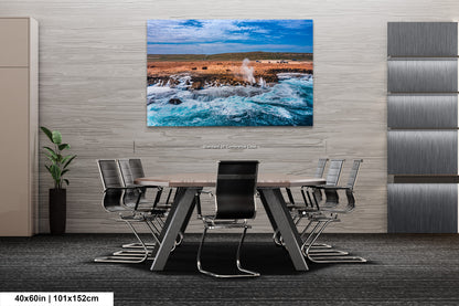 a dining room table with chairs and a painting on the wall