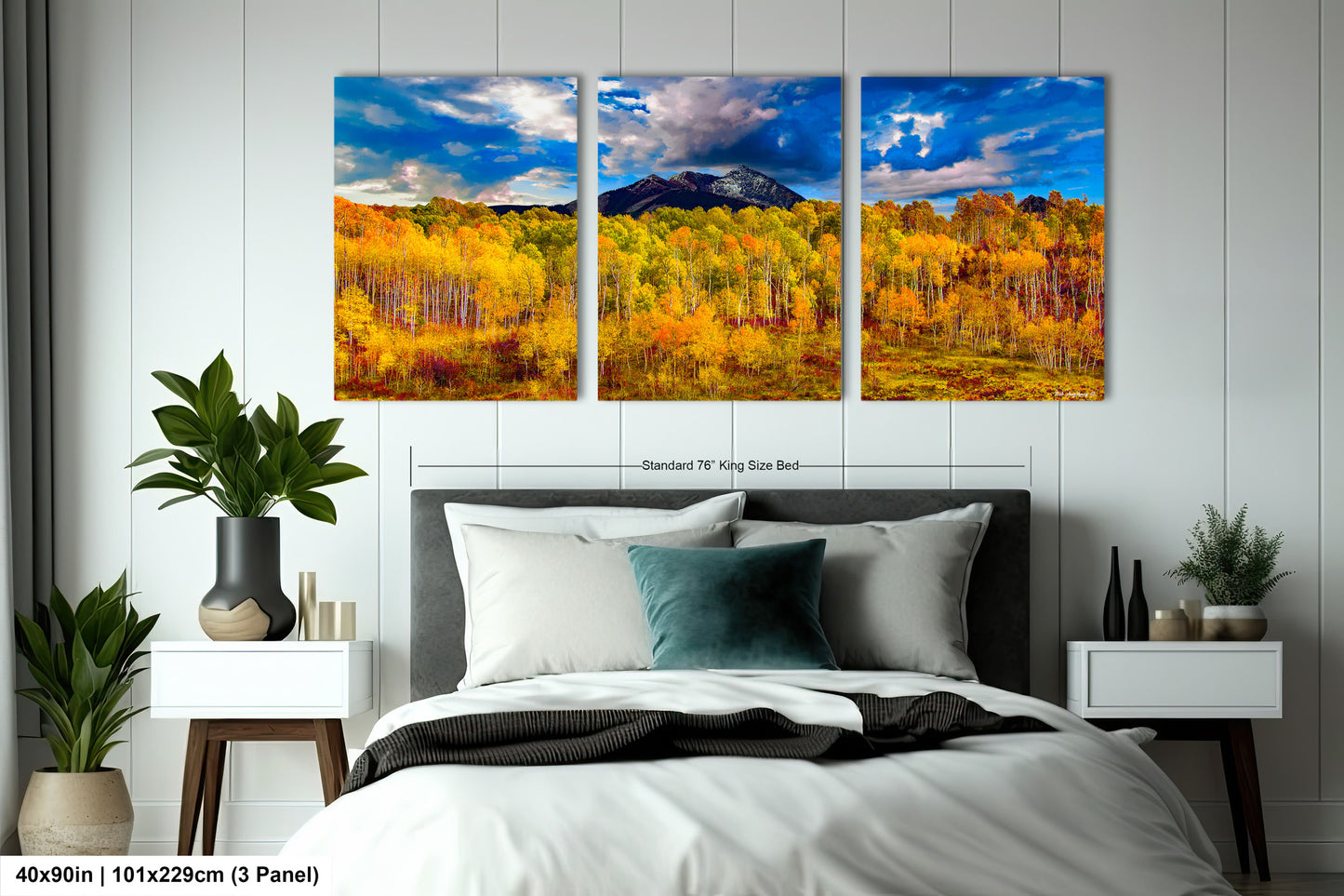 a bed room with a neatly made bed and paintings on the wall