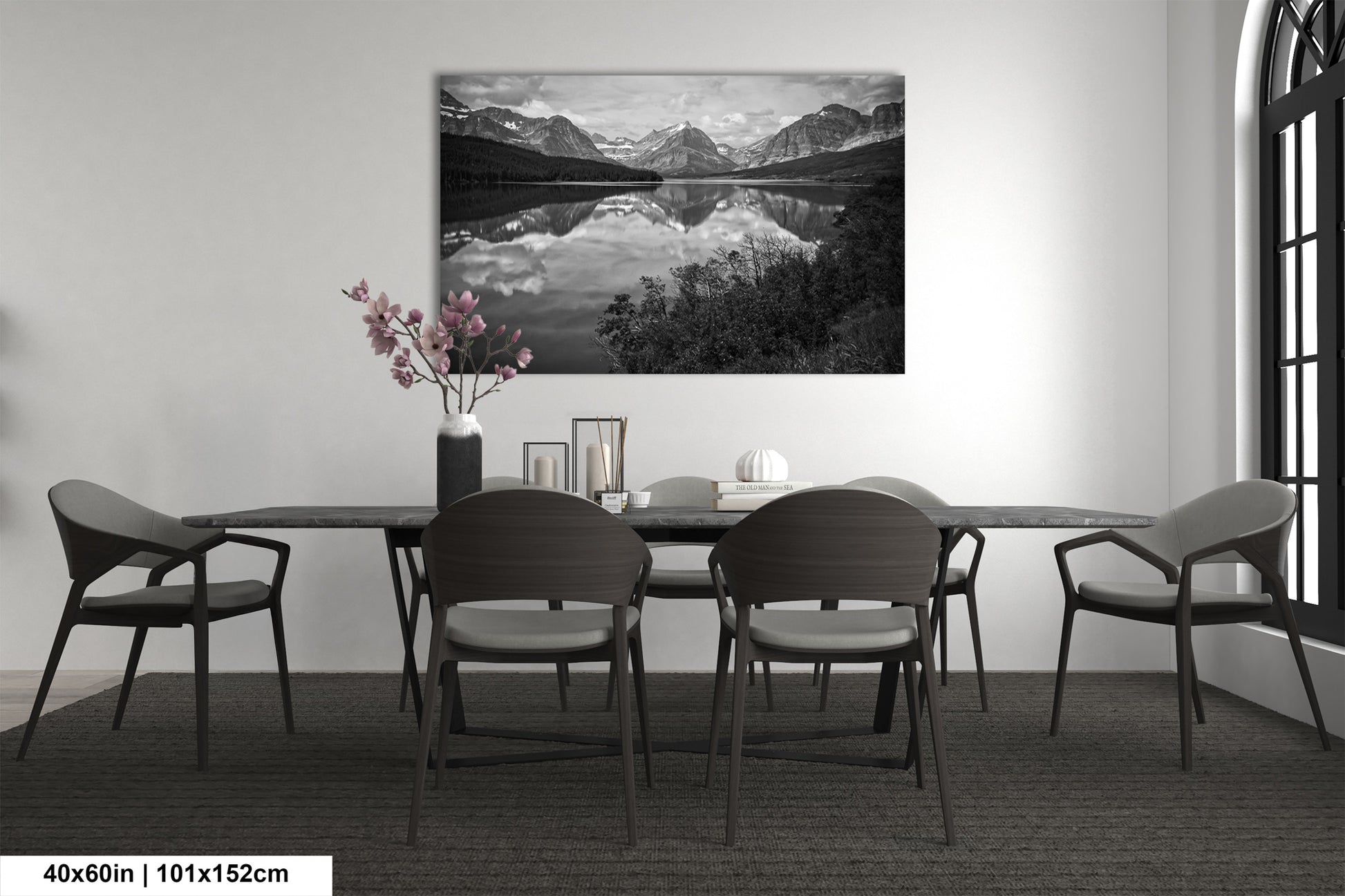a black and white photo of a dining room table