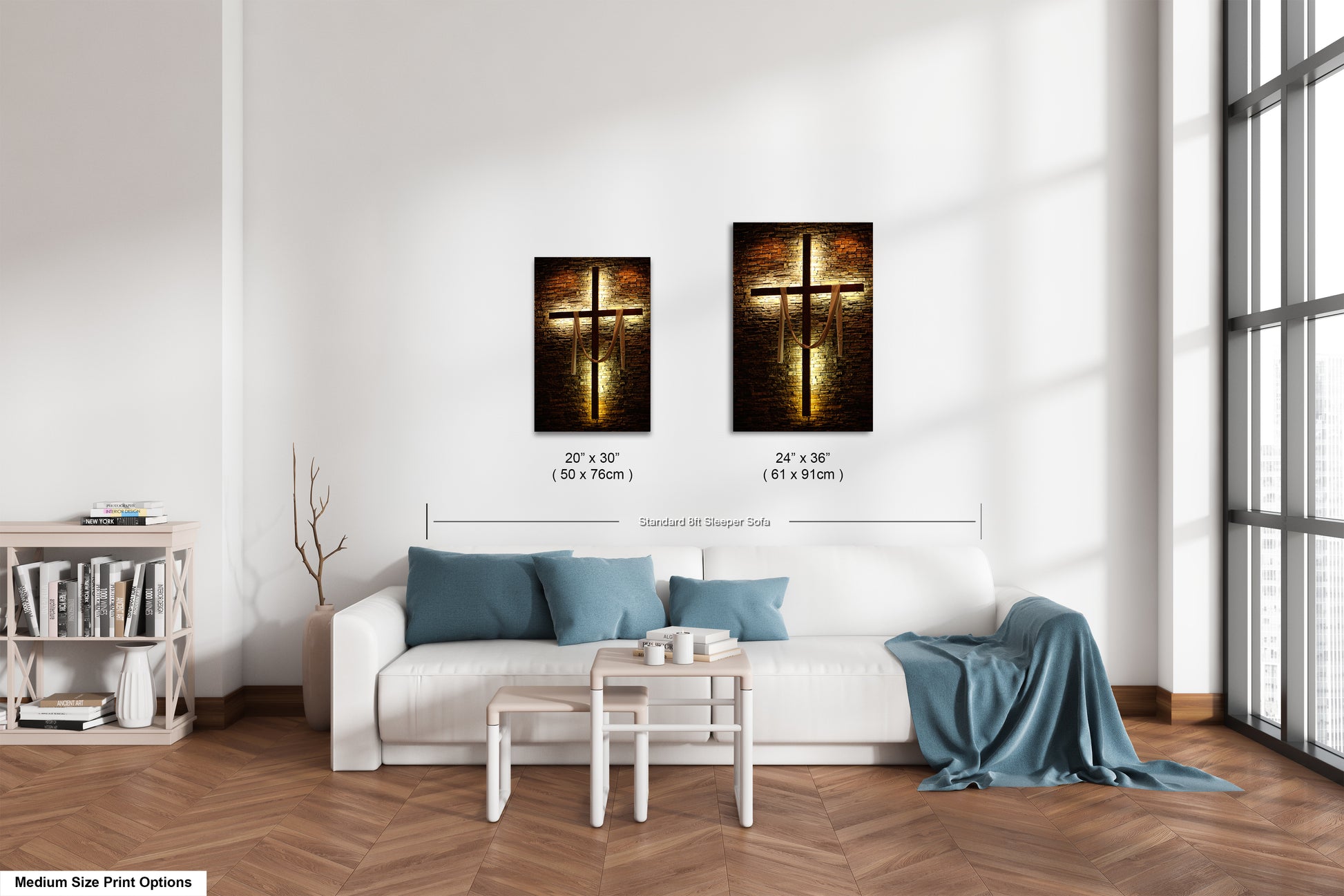 a living room with a white couch and two paintings on the wall