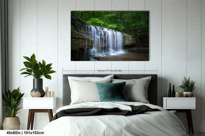 a bedroom with a bed and a painting on the wall