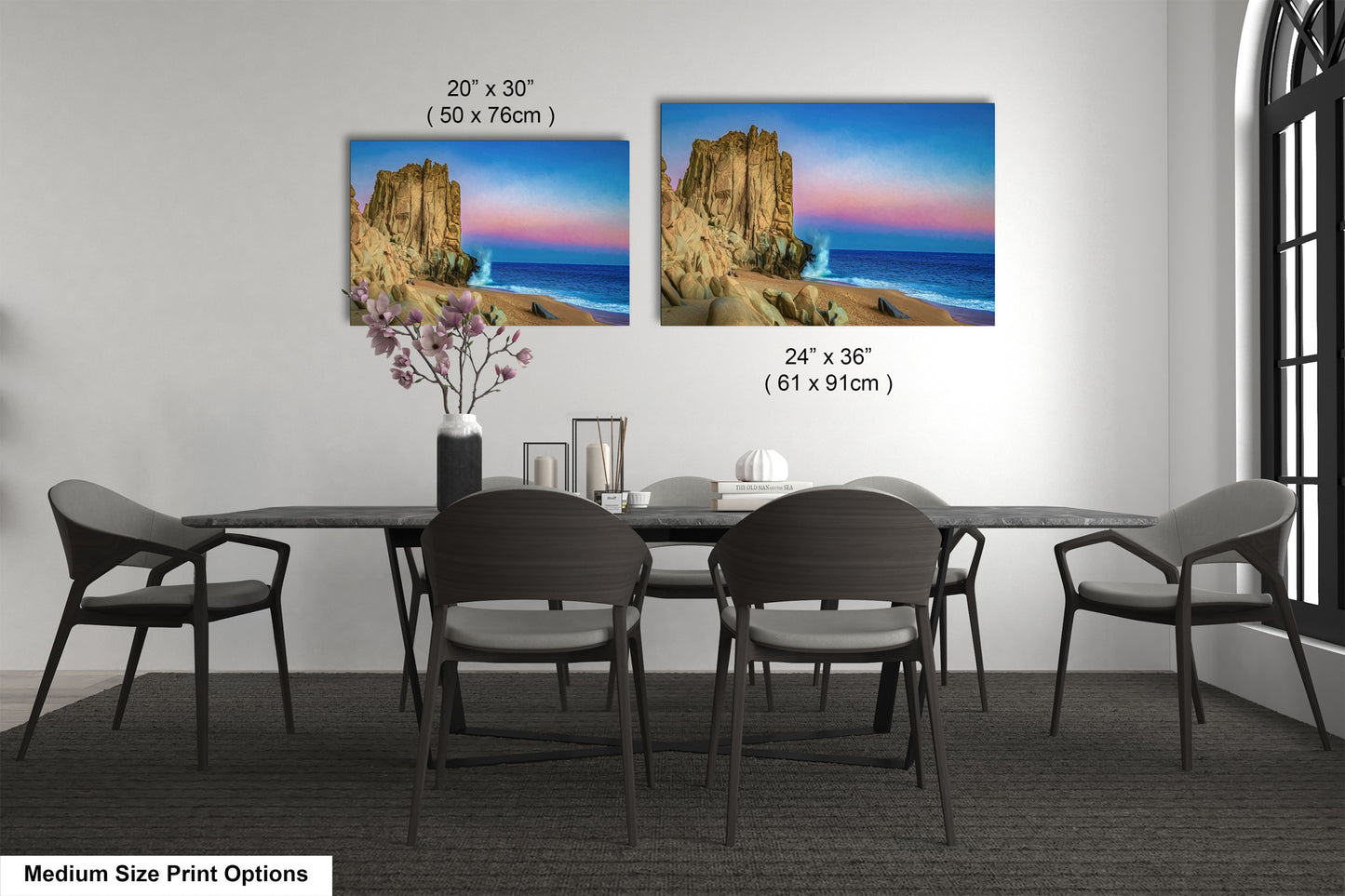 a dining table with four chairs and a vase of flowers