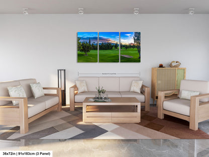 a living room filled with furniture and a painting on the wall