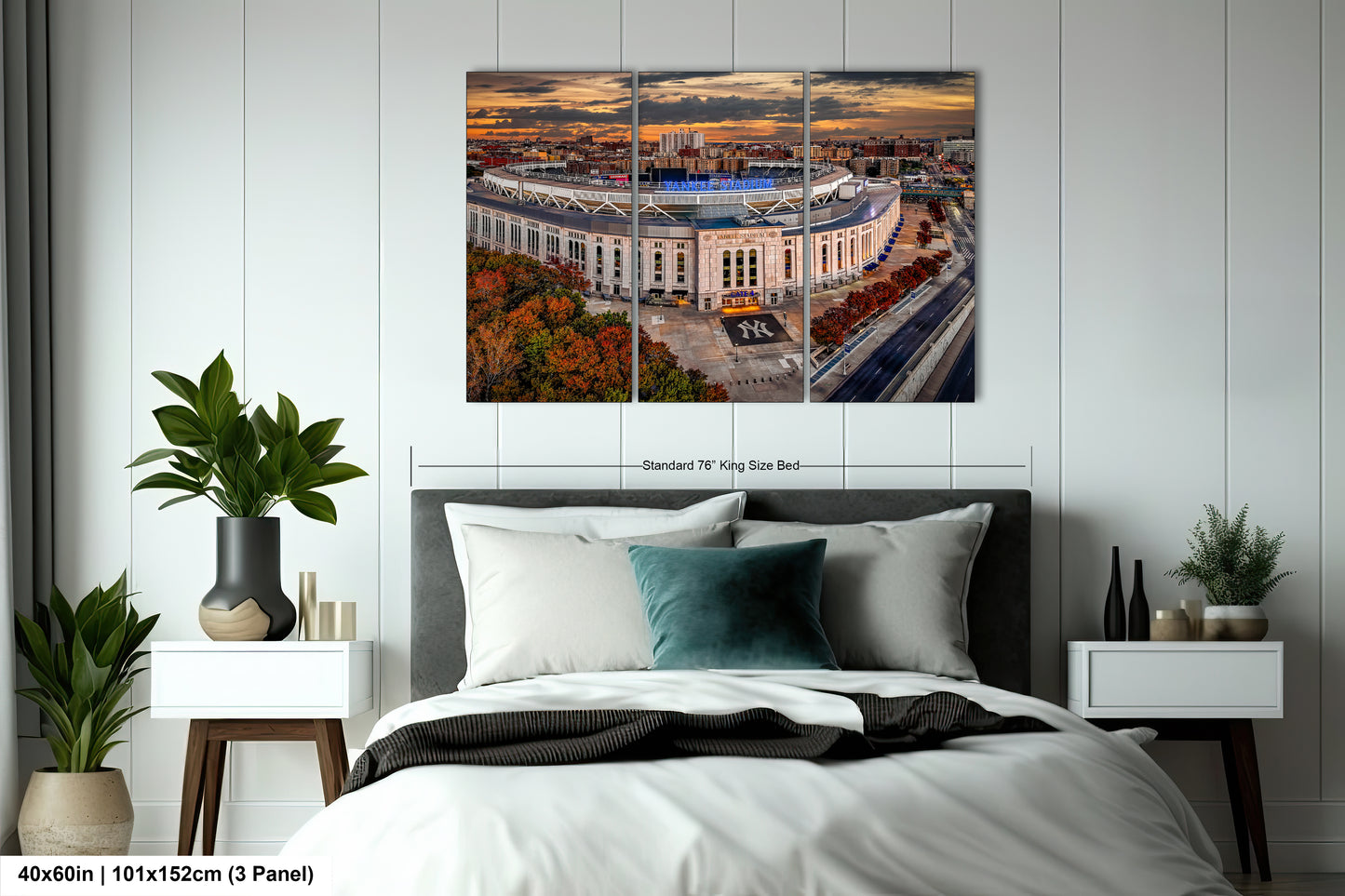 a bedroom with a large bed and a picture on the wall