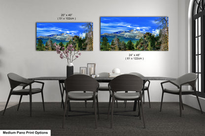 a dining room table with four chairs and a vase of flowers