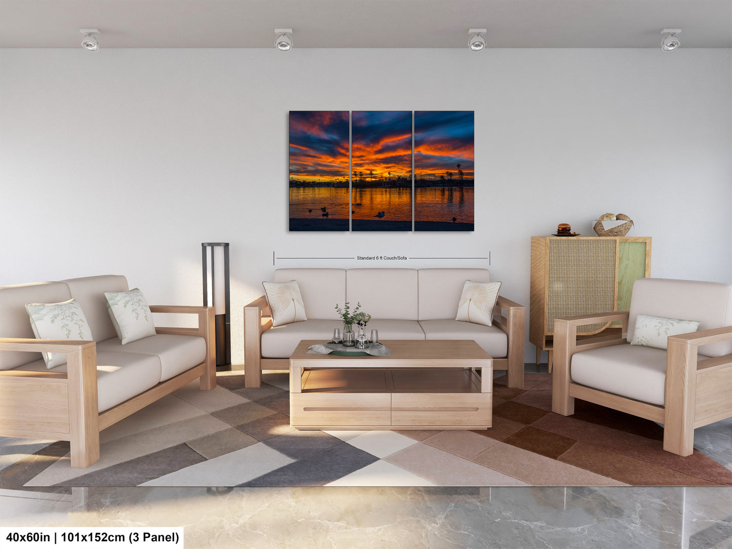 The image is a modern living room with a large, colorful painting of a sunset over a body of water hanging on the wall. The room is furnished with a sofa, two chairs, and a coffee table, creating a comfortable and inviting atmosphere.