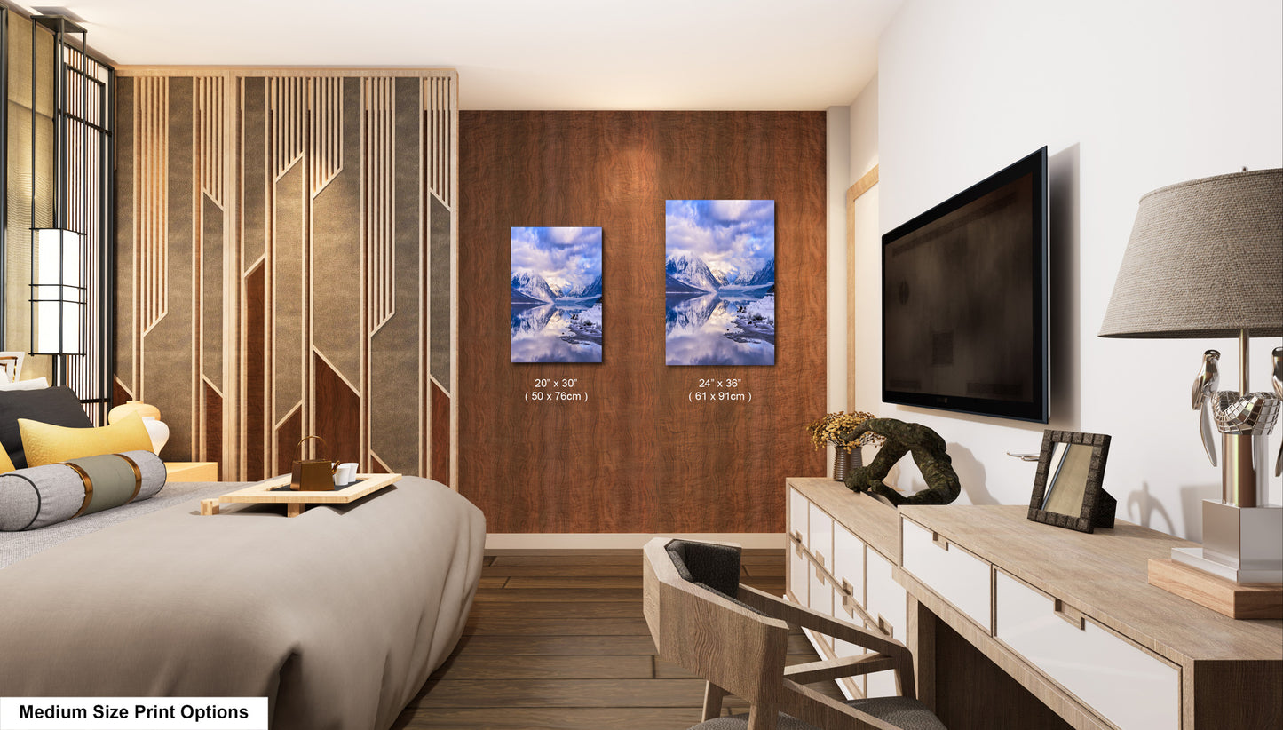 a bed room with a neatly made bed and a flat screen tv