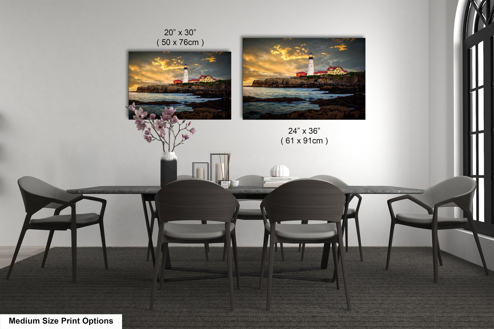 a dining room table with four chairs and a vase of flowers