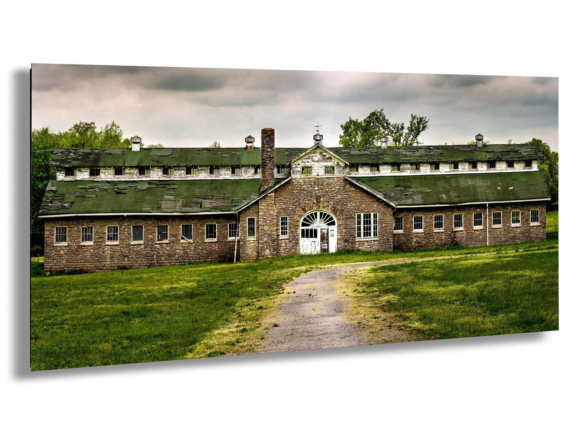 a large brick building with a green roof
