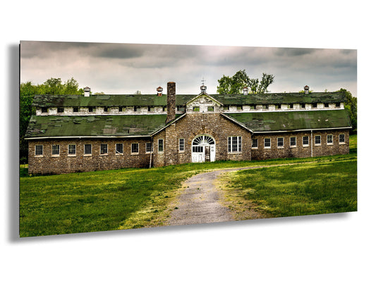 a large brick building with a green roof