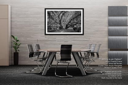 a black and white photo of a table and chairs