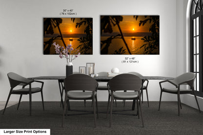 a dining room table with chairs and a vase of flowers