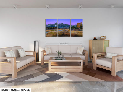 a living room filled with furniture and a painting on the wall