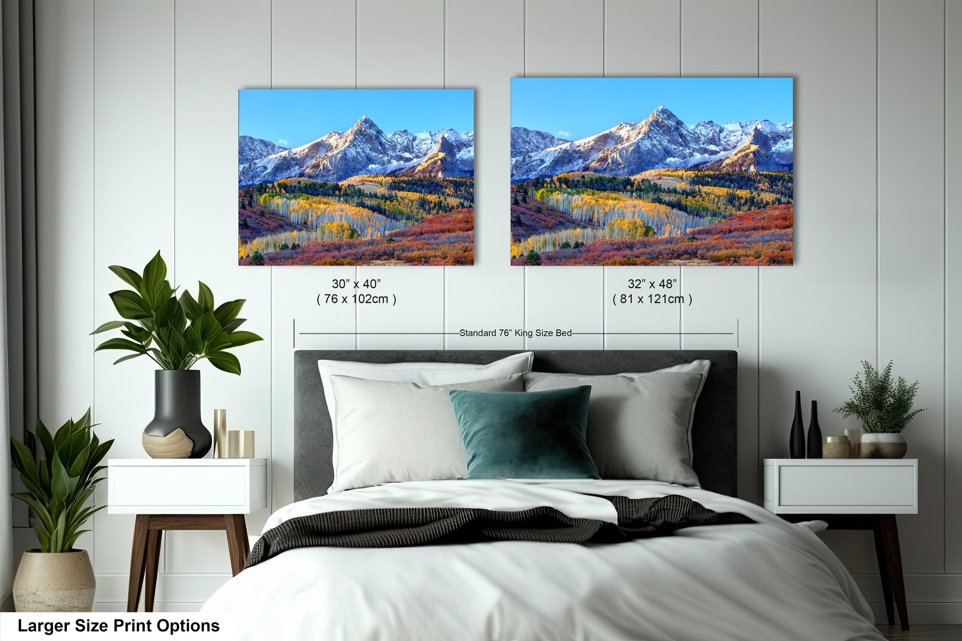 a bedroom with a bed and two pictures on the wall