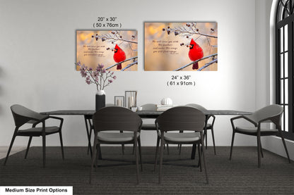 a dining room table with chairs and a vase with a cardinal on it