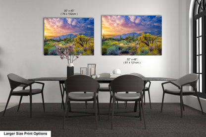a dining room table with chairs and a painting on the wall