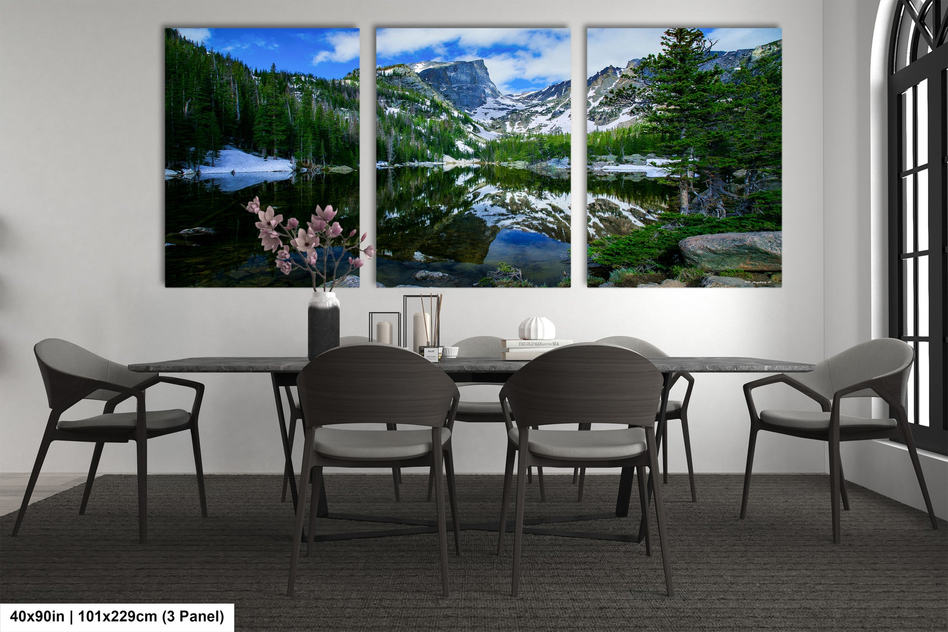 a dining room with a table and four chairs