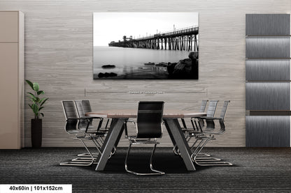 a black and white photo of a table and chairs