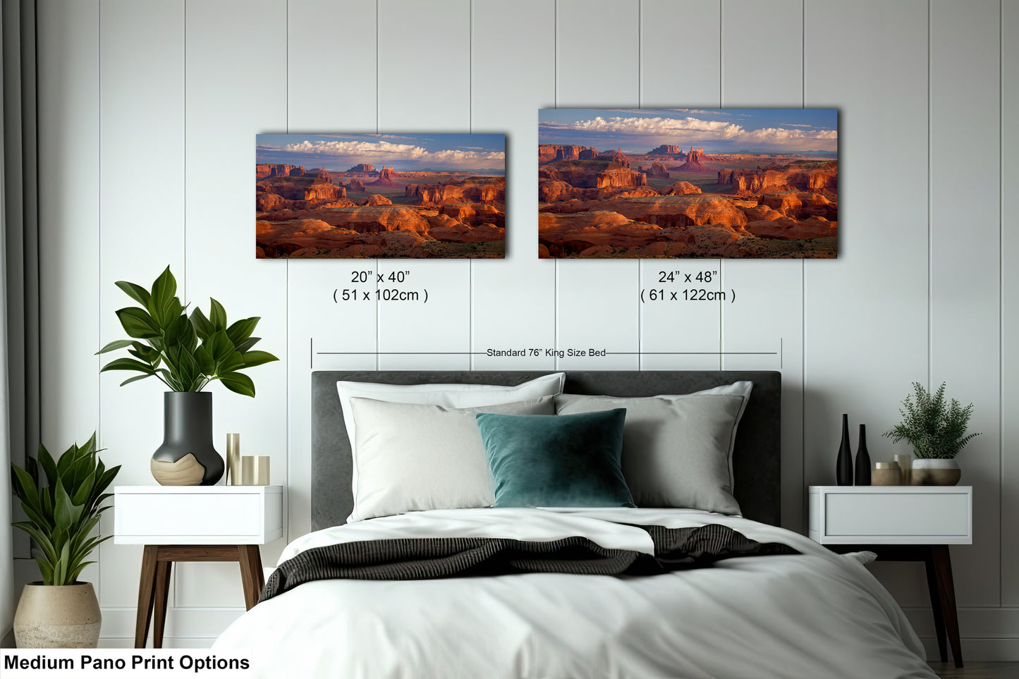a bedroom with a bed and two pictures on the wall
