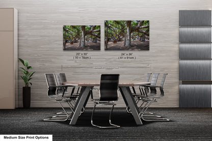 a dining room table with chairs and two pictures on the wall