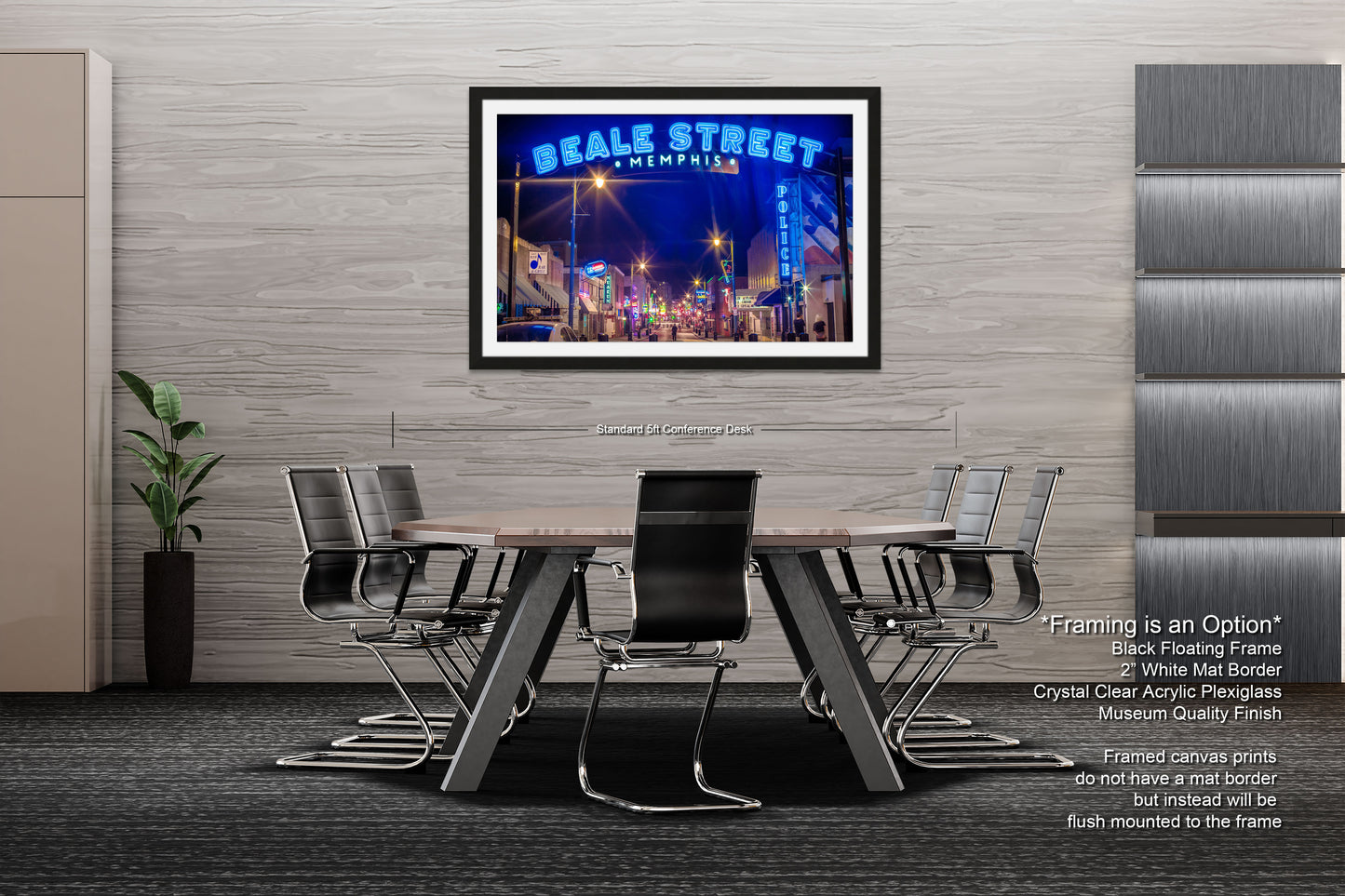 a dining room table with chairs and a poster on the wall