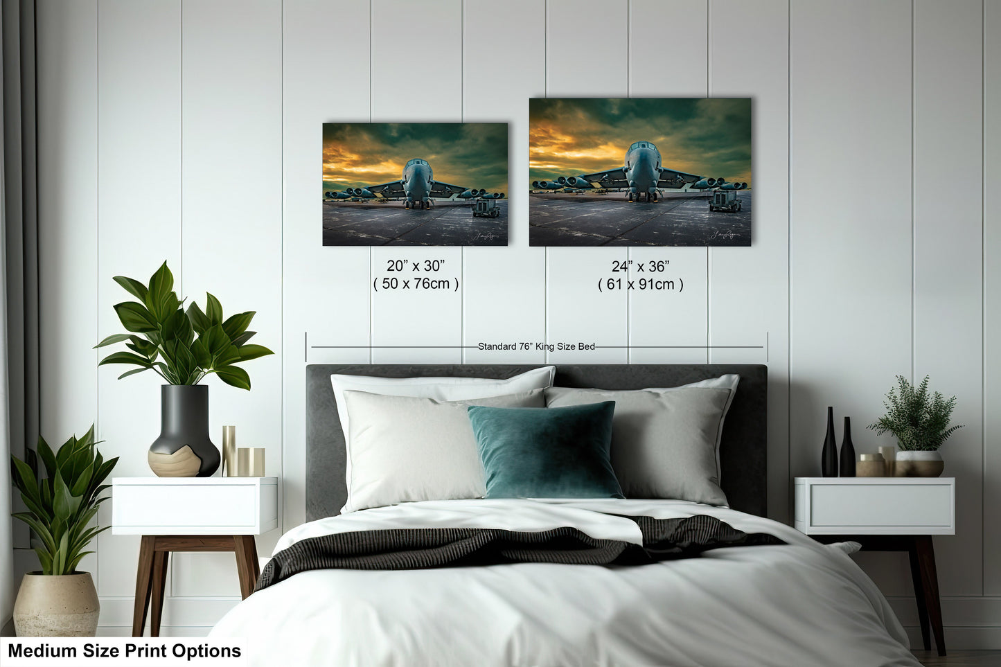 a bed room with a neatly made bed and two pictures on the wall