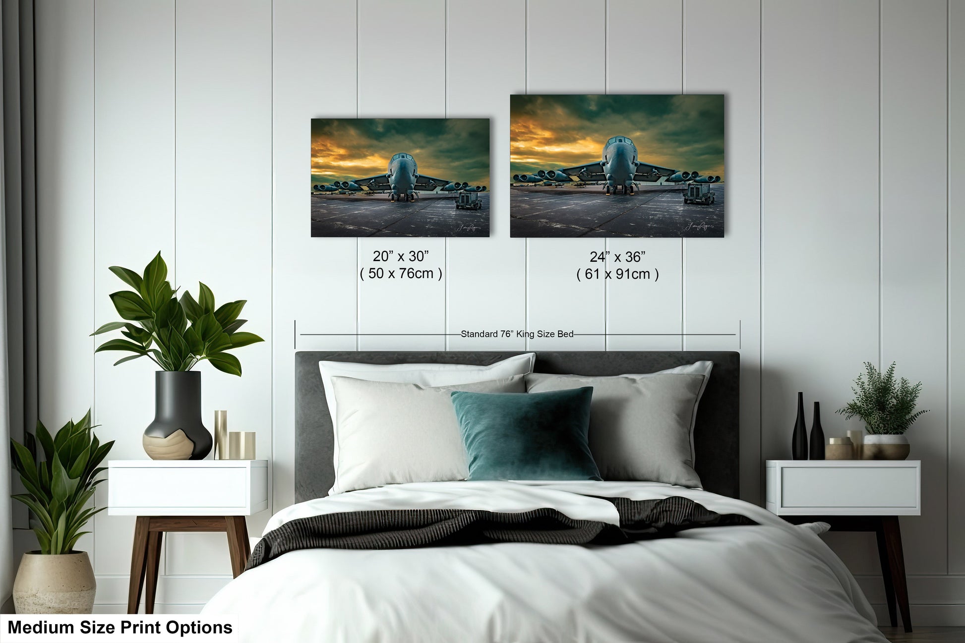 a bed room with a neatly made bed and two pictures on the wall