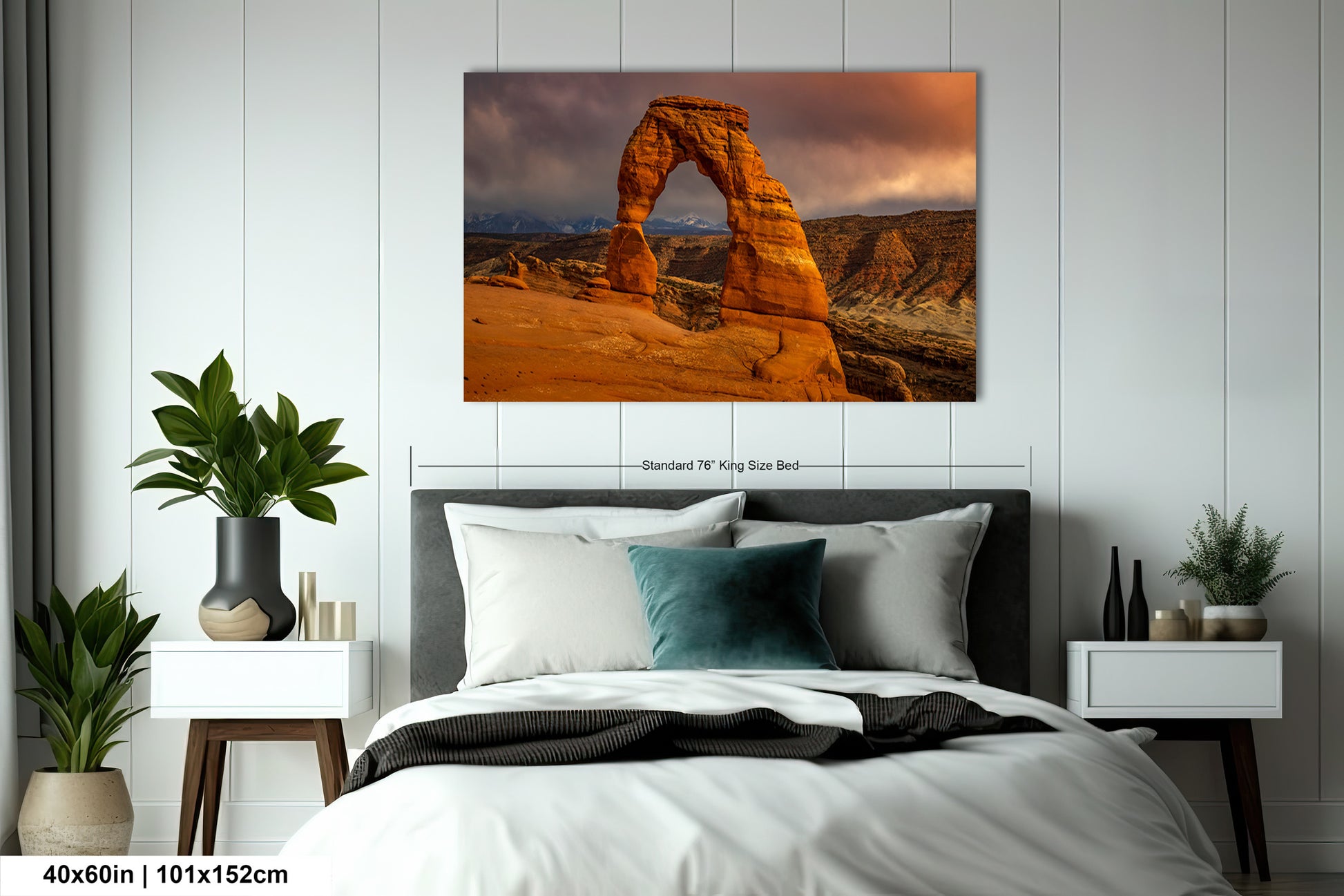 a bed in a room with a picture on the wall