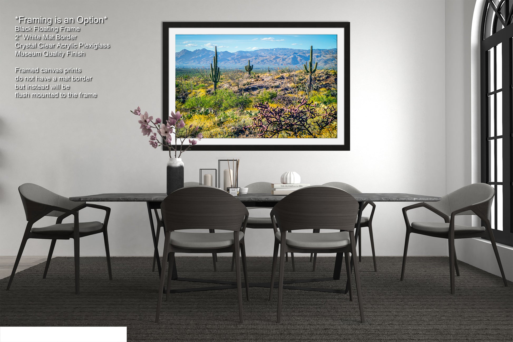 a modern dining room with a large framed landscape painting hanging on the wall above a black dining table surrounded by six chairs.