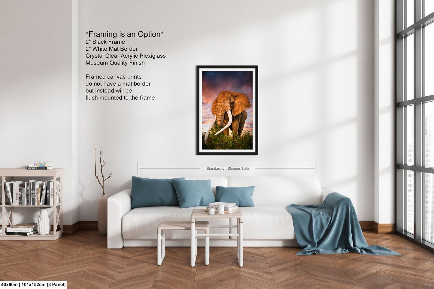 a living room with a white couch and a painting of an elephant