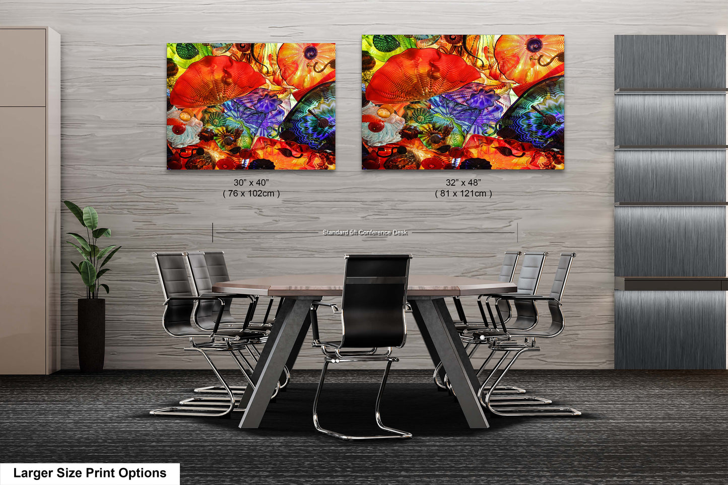 a dining room table with chairs and two paintings on the wall