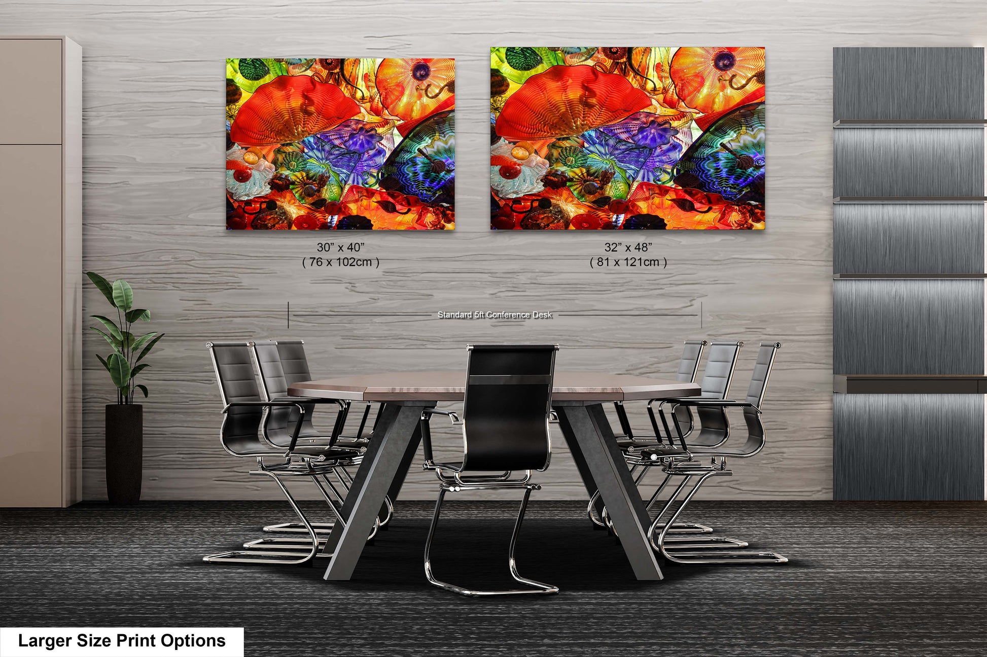 a dining room table with chairs and two paintings on the wall