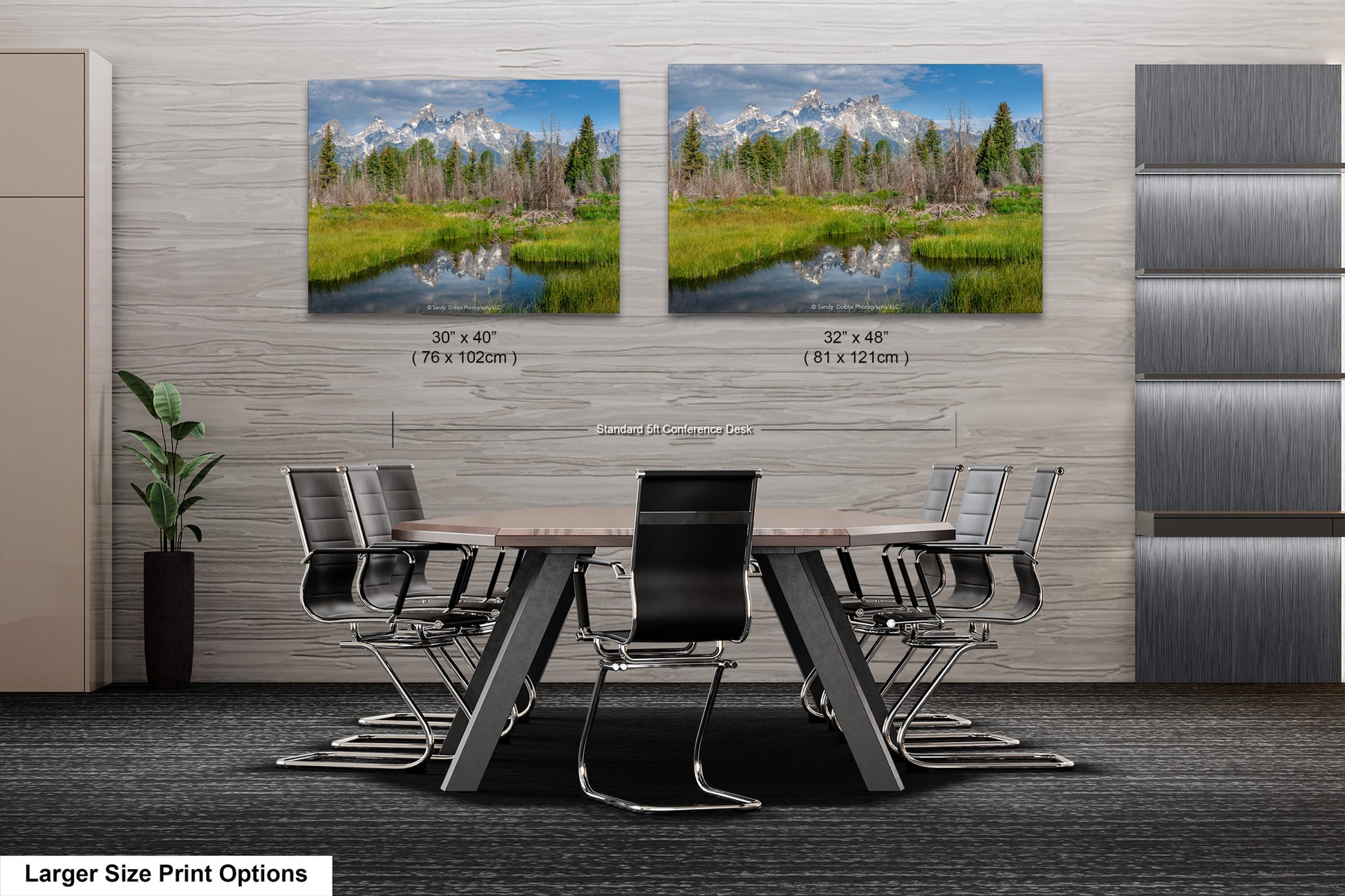 a dining room table with chairs in front of a wall with two pictures of a