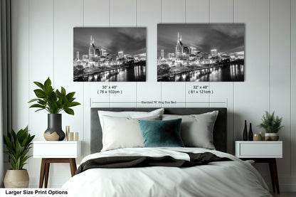a bedroom with a bed and two pictures on the wall
