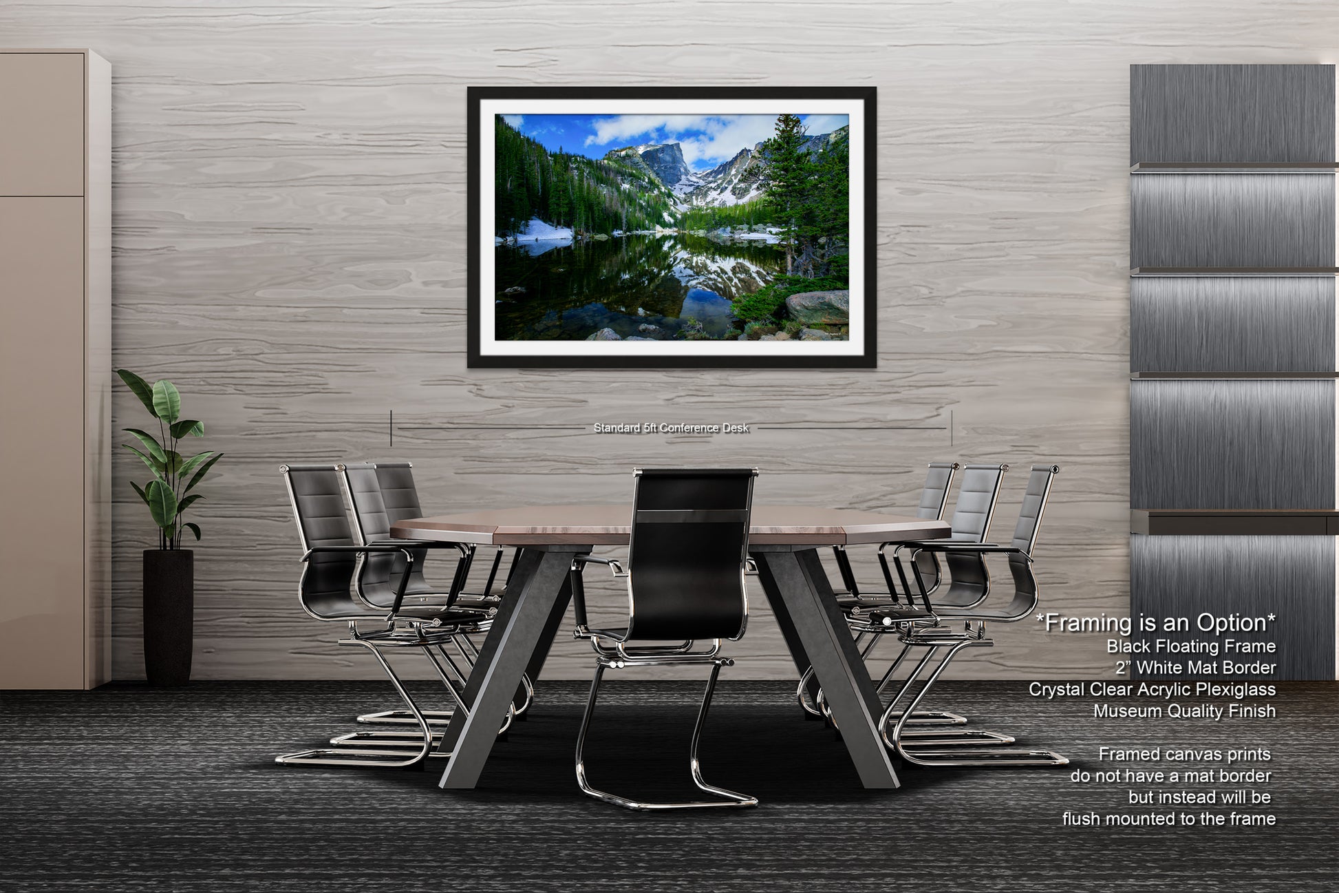 a dining room table with chairs and a picture hanging on the wall
