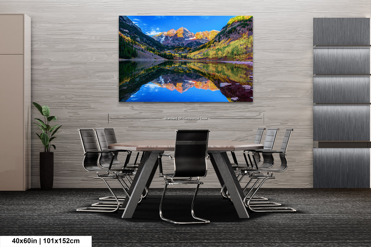 a dining room table with chairs and a painting on the wall