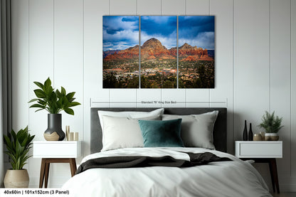 a bed room with a neatly made bed and a painting on the wall