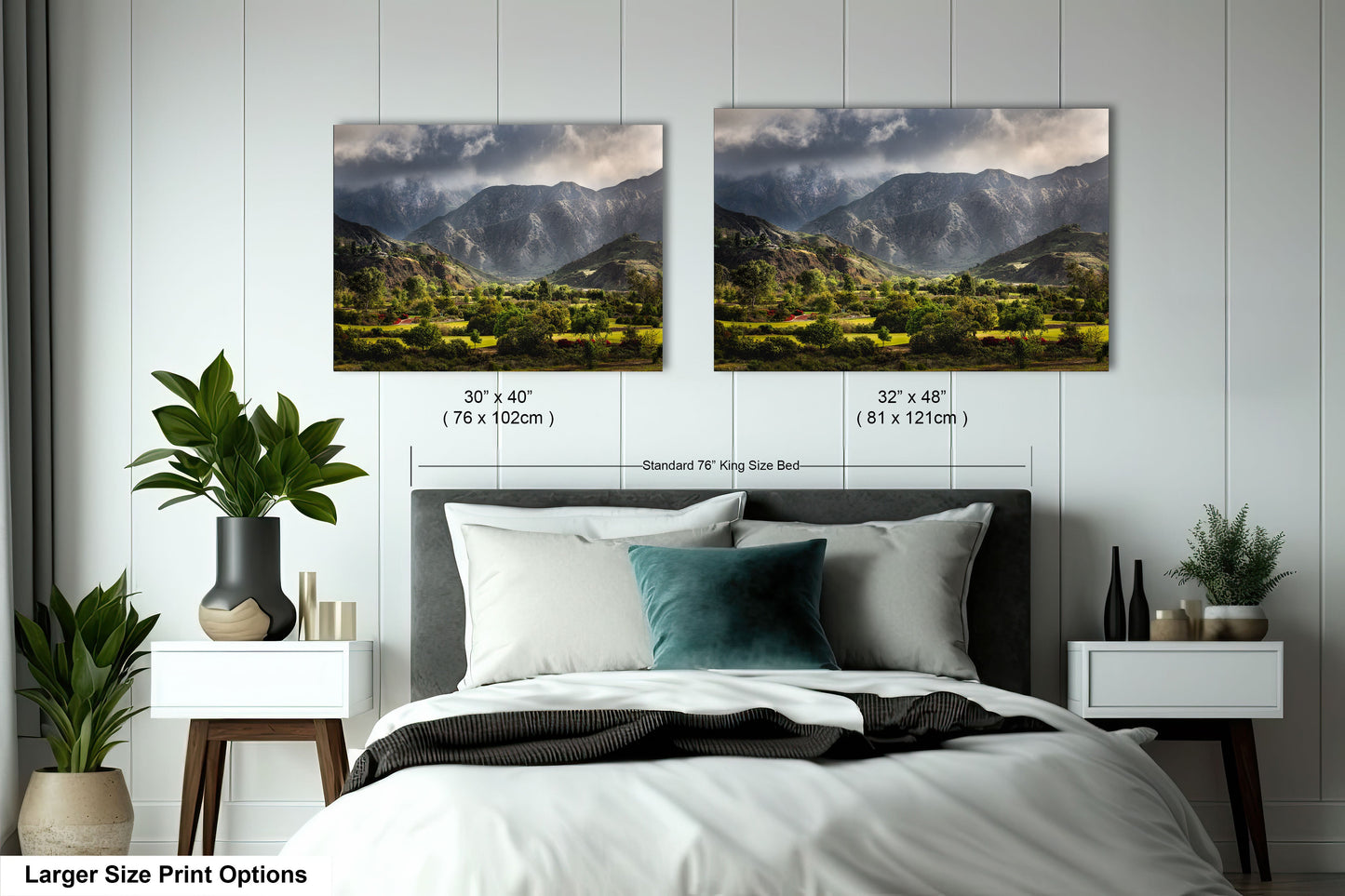 a bedroom with a bed and two pictures on the wall