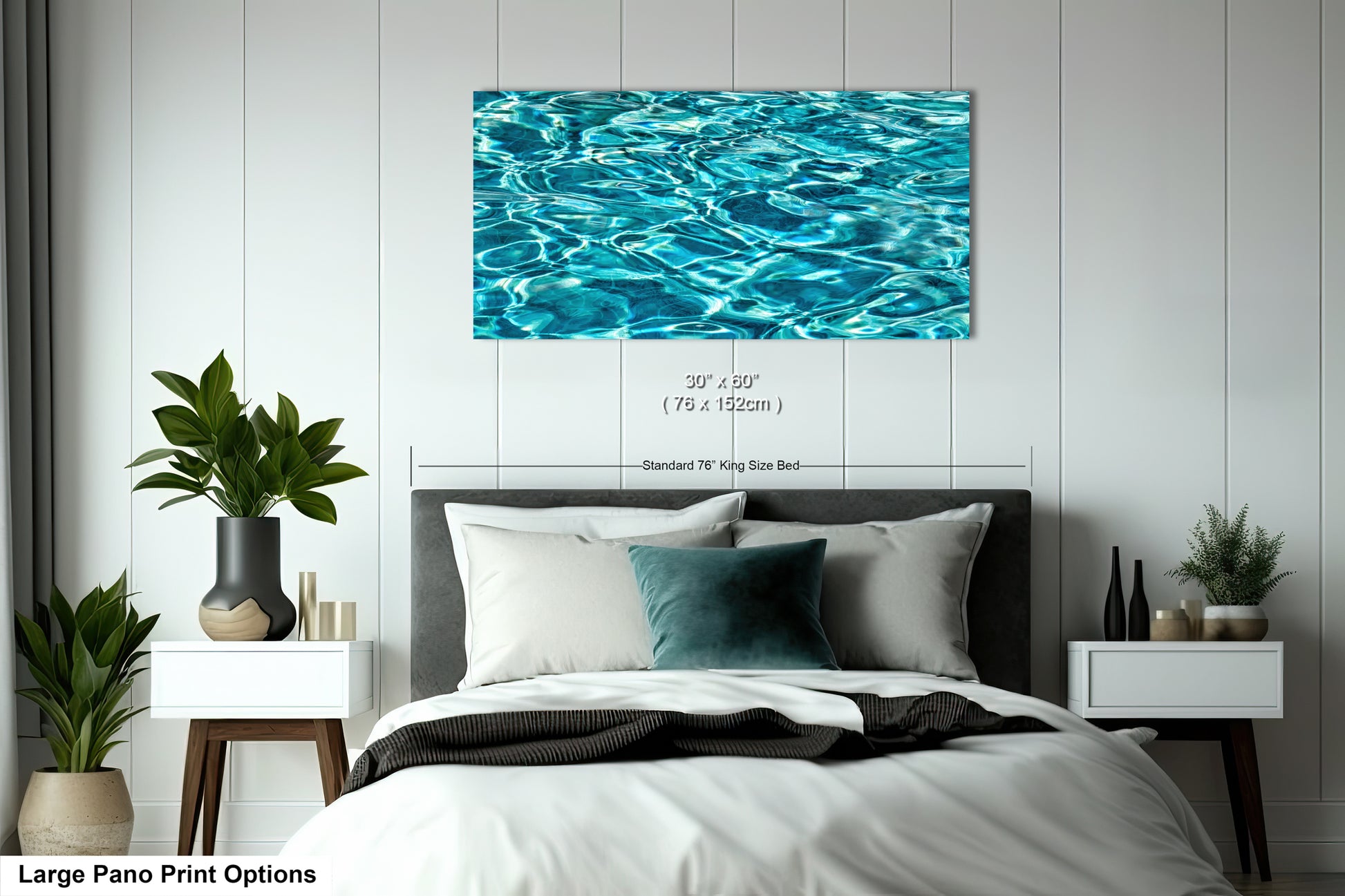 A large bedroom with a bed, nightstands, and a large framed print of a water-themed image hanging on the wall above the bed.