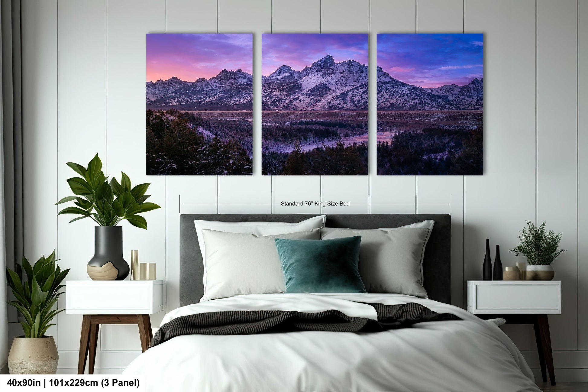 a bedroom with a bed and two paintings on the wall