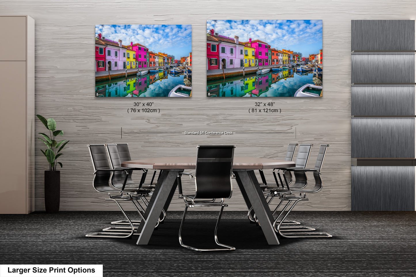 a dining room table with chairs and two pictures of buildings