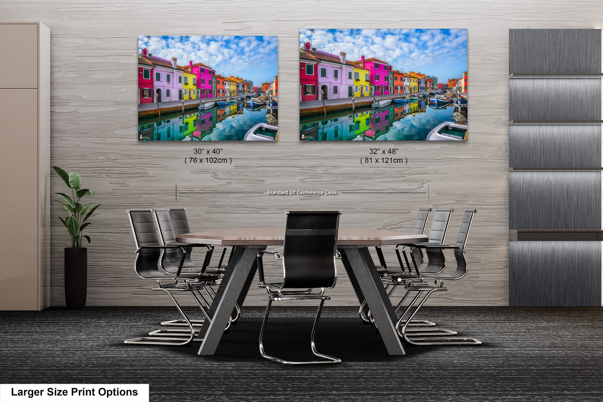 a dining room table with chairs and two pictures of buildings