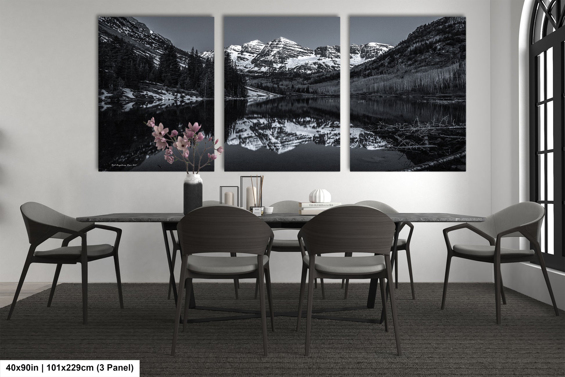 a black and white photo of a dining room table
